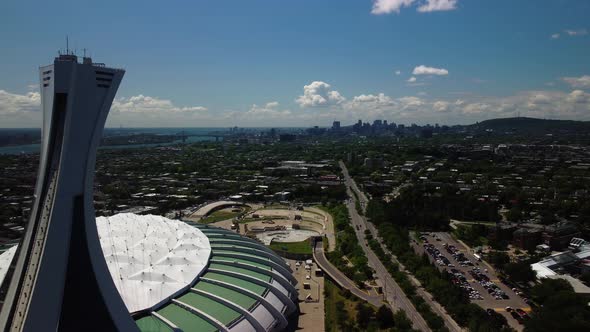 Aerial drone shot of Olympic Stadium in Montreal during summer, close, dolly out