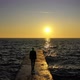 Slow Motion Female Walking by The Ocean with Waves on Sunset - VideoHive Item for Sale
