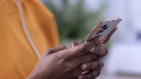 African American Girl Using Smartphone Pressing Finger Reading Social Media Internet Typing Text or