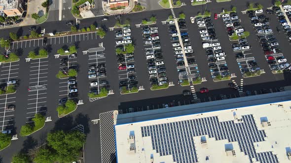 The Road and Infrastructure Bridge on of Parking Lot with Colorful Cars Near on Shopping Center a