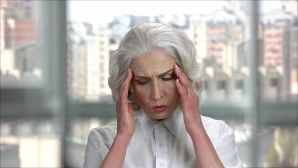 Old Businesswoman's Suffering From Headache