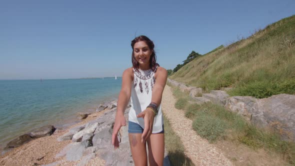 POV Shot of Girl Pulling Boyfriend Along The Beach His Hand in Slowmotion