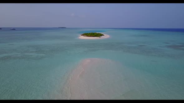 Aerial travel of tranquil tourist beach trip by blue water and white sand background of journey near