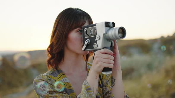 Girl Does Video Shooting in the Countryside Among the Soap Bubbles