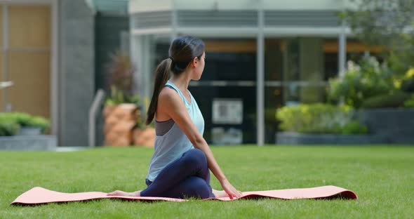 Woman do yoga at the park