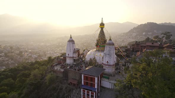 Aerial view circling around Swayambhunath Stupa on hilltop