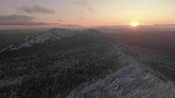 Drone Flight Through Dramatic, Snowy Winter Mountain Range