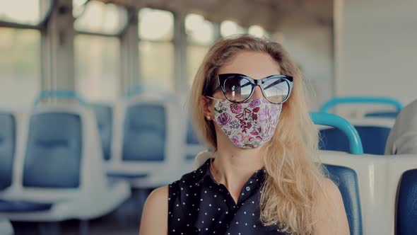 Woman In Transport Train In Protective Mask Sars COVID19 Virus. Pandemic Coronavirus Covid-19