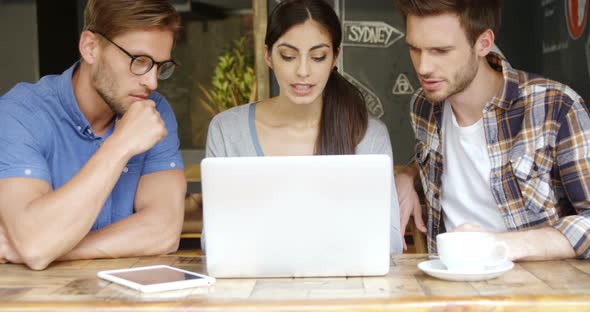 Group of Friends Discussing Over Laptop 4k