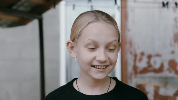 Closeup of a Girl Who is Negotiating in a Video Chat on the Street