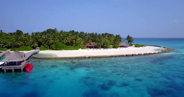 Luxury drone tourism shot of a sunshine white sandy paradise beach and blue sea background in best q