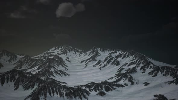 Mountains in Evening Cloudy Sky alt