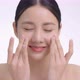 Zoom Out Shot Beautiful Face Of Young Adult Asian Woman Massages Her Clean Fresh Skin Genly. - VideoHive Item for Sale