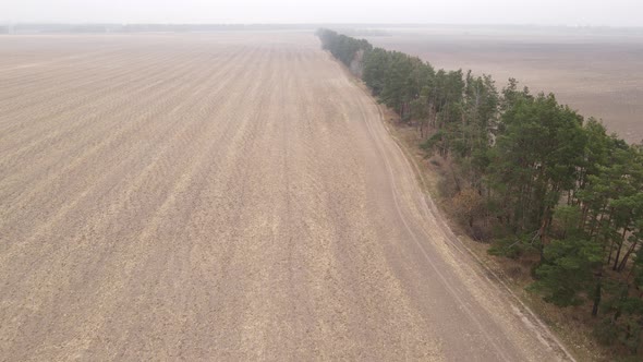 Empty Plowed Field in Autumn Aerial View