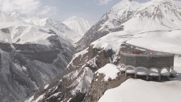 Gudauri, Georgia - April 12, 2021: Aerial view of Russia–Georgia Friendship Monument