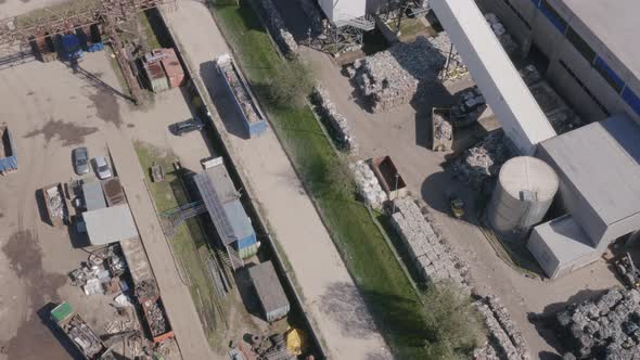 Truck Passing By With Scrap Metal Load next to Recycling Center