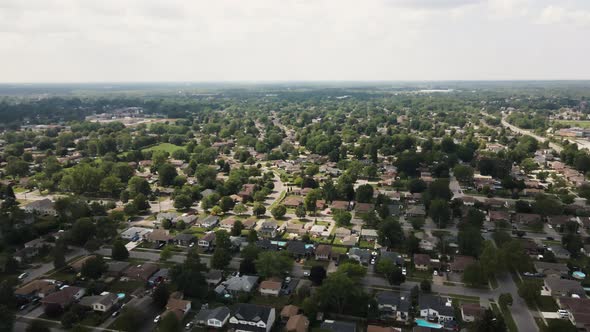 Aerial flyover beautiful rural suburb city in Canada during sunny day in summertime