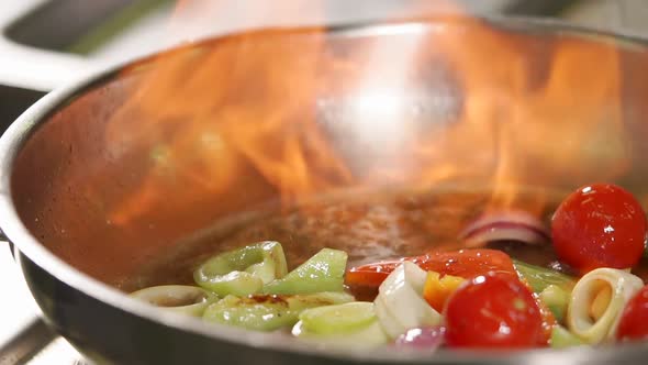 Cook Fires Up Oil in a Pan