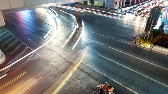 Time Lapse Traffic Street Crossroad in the Downtown at Night Time, Top View