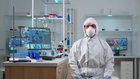Lab Technician in Ppe Suit Working with Virtual Reality alt