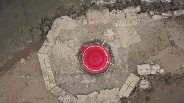 Drone View Top of Red Roof of Sea Lighthouse on Edge Seaside