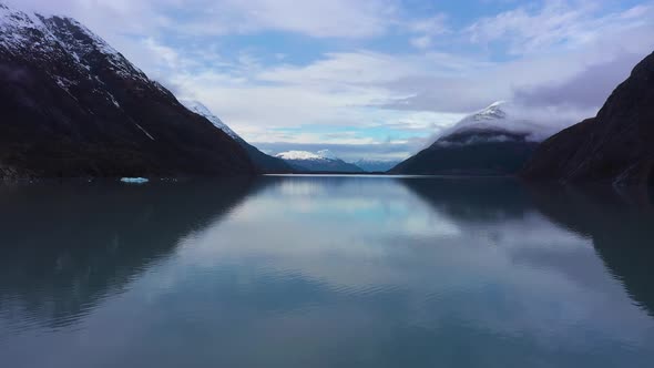 Portage Lake Ice Blocks and Mountains on Sunny Day