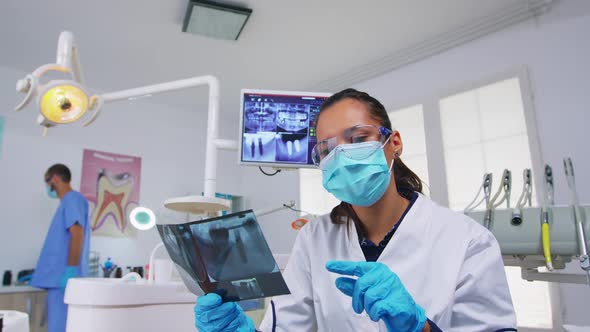 Patient Pov in Dental Office Explaining Treatment of Teeth Cavity