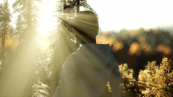 Young Woman Standing Alone Outdoor with Wild Forest Mountains