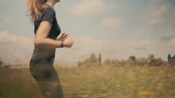 Runner Girl In Sportswear Training For Triathlon. Hair Blowing When Triathlete Girl Running. Workout