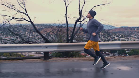 Man Running In The Rain