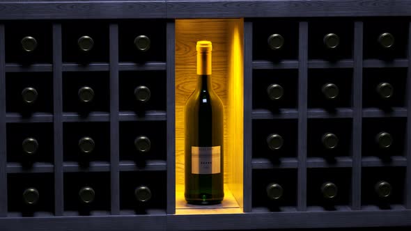 Luxury wine storage. Wooden shelf with one standing bottle. Wine cellar. 4KHD