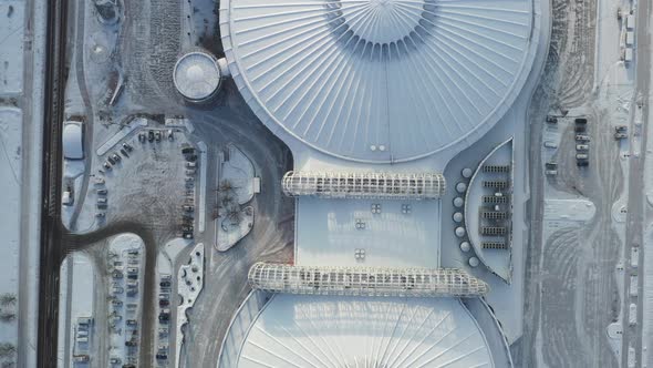 Top view in winter of a modern sports complex with parking in Minsk. Belarus