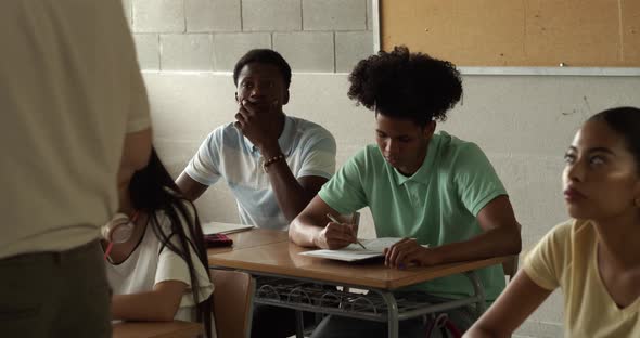 Multiethnic Adolescent Students in Class Listen Attentively to the Teacher