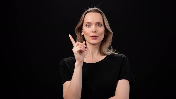 Pensive Woman Thinking Smiling Having Idea Posing Isolated on Black