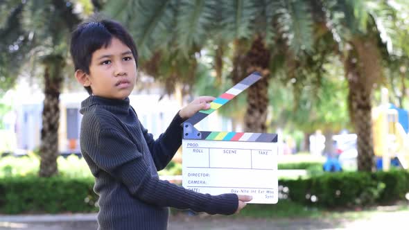 The Boy Holding Cinema Slate