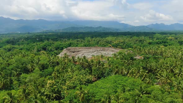 Huge stack of garbage in jungle near Magelang, Indonesia, aerial view