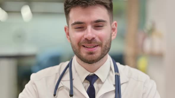 Friendly Young Doctor Talking on Video Call