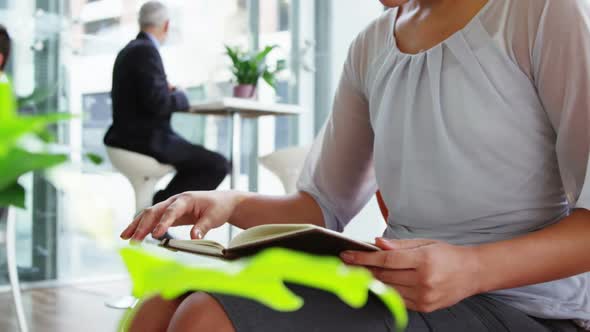 Business woman looking at diary