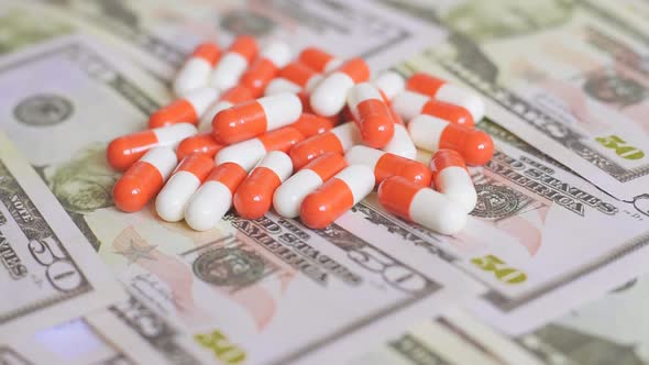 The medical pills are on a money, expensive medicine concept. Rotation video