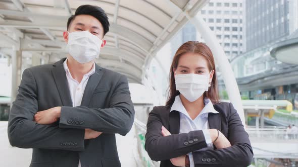 Portrait of Group of young office businesspeople standing outdoor in city with new normal lifestyle.