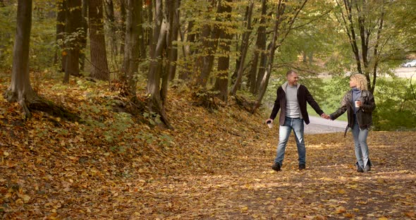 Happy Couple on a Date in the Autumn Forest