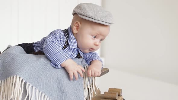 Adorable Little Boy Wearing a Gray Cap