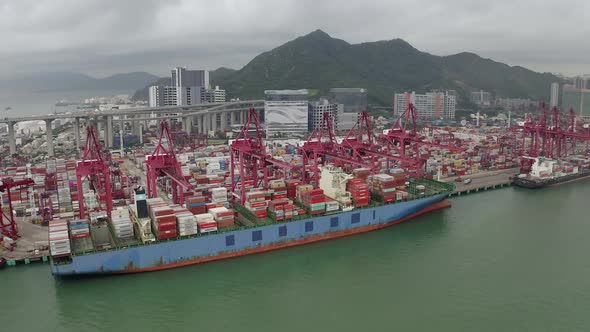 Drone Aerial view 4k Footage of Shipping to harbor by crane in Victoria Harbour