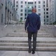 Tracking Shot of Unrecognizable Guy with Laptop Walking on Stairs on City Street - VideoHive Item for Sale