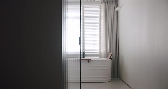 Transparent Sliding Door Opens Inside the Modern Bathroom Minimalist Bathtub