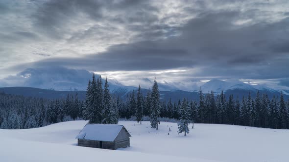 Time Lapse of Flowing Clouds Over the Mountains and Forest in Winter