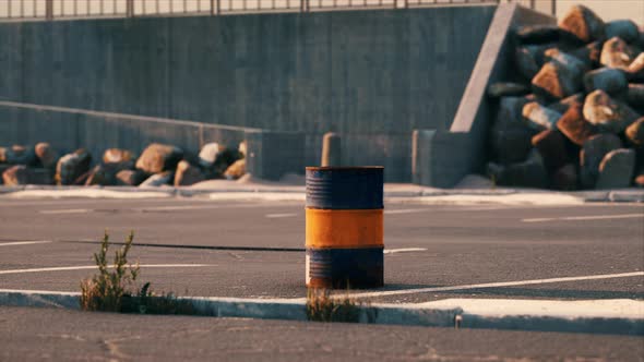 Old and Rusty Metal Barrel on Parking