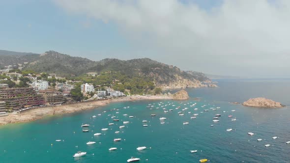 Beautiful rocky coast with beach and boats