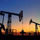 Two Oil Pump Jacks Extracting Crude Oil Under Beautiful Sunset Sky - VideoHive Item for Sale