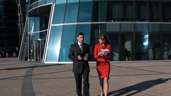 Businesswoman and Businessman with Tablet Computer